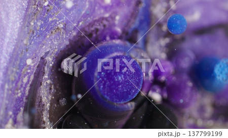 Paint stream. Ink spilling. Defocused blue purple white color water bubble dark black fluid floating on abstract bokeh art background. Paint stream. Ink spilling. Defocused blue purple white color water bubble dark black fluid floating on abstract bokeh art background. 137799199