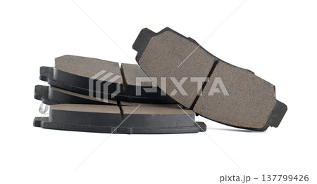 Stack Of New Brake Pads For Car Maintenance And Auto Repair On White Background 137799426
