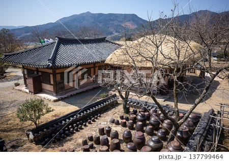 Korean traditional house and mountain landscape in clear weather Korean traditional house and mountain landscape in clear weather 137799464