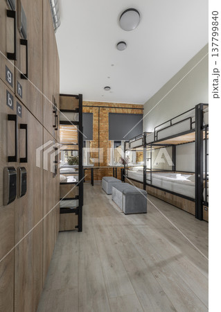 Modern Hostel Dormitory with Bunk Beds and Wooden Electronic Lockers Modern Hostel Dormitory with Bunk Beds and Wooden Electronic Lockers 137799840