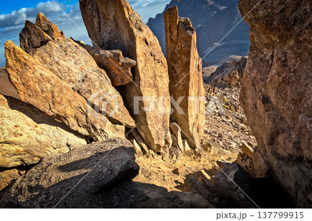 Sharp rock ridges and boulders encountered during the trek through the Tashkent sites area. 137799915
