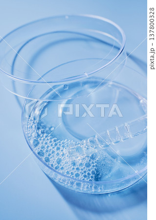 Science experiment showing liquid with bubbles and dropper in sterile petri dish Science experiment showing liquid with bubbles and dropper in sterile petri dish 137800328