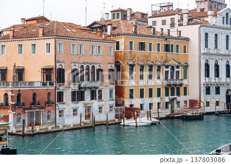 Colorful buildings along a canal in Venice during daytime with clear blue water 137803086