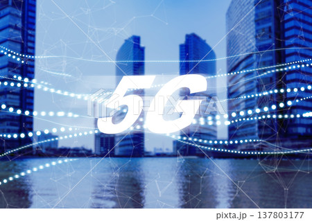 5G internet technology is seen in a city with tall buildings beside water during daytime 137803177