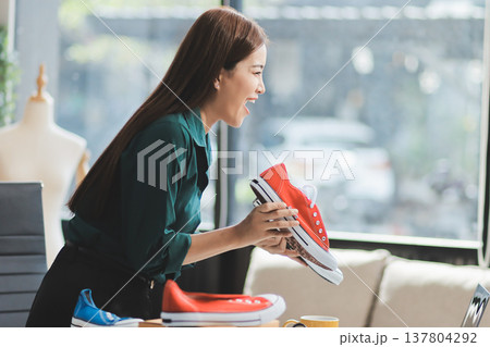 Starting small businesses SME owners female entrepreneurs check online orders to prepare to pack the boxes, sell to customers, sme business ideas online. Starting small businesses SME owners female entrepreneurs check online orders to prepare to pack the boxes, sell to customers, sme business ideas online. 137804292