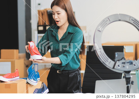 Starting small businesses SME owners female entrepreneurs check online orders to prepare to pack the boxes, sell to customers, sme business ideas online. Starting small businesses SME owners female entrepreneurs check online orders to prepare to pack the boxes, sell to customers, sme business ideas online. 137804295