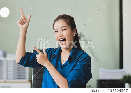 Young Asian businesswoman giving presentation Young Asian businesswoman giving presentation 137804337