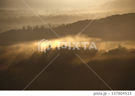 Soft morning light spreads across the peaceful landscape. 137804515