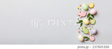 holiday preparation Multi colors Easter eggs with cookies on colored background . Pastel color Easter eggs. holiday concept with copy space 137805300