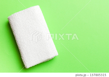 Top view of white towels with copy space on colored background Top view of white towels with copy space on colored background 137805315
