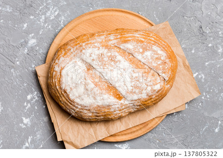 Freshly baked bread on cutting board against white wooden background. top view bread with copy space 137805322
