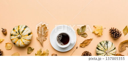 Flat lay composition with colorful Autumn cup of coffee and leaves on a color background. top view 137805355