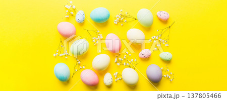 Happy Easter composition. Easter eggs on colored table with gypsophila. Natural dyed colorful eggs background top view with copy space Happy Easter composition. Easter eggs on colored table with gypsophila. Natural dyed colorful eggs background top view with copy space 137805466