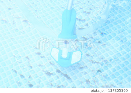 pool vacuum cleaner in the water. dirty pool water surface, season luxury life concept top view pool vacuum cleaner in the water. dirty pool water surface, season luxury life concept top view 137805590