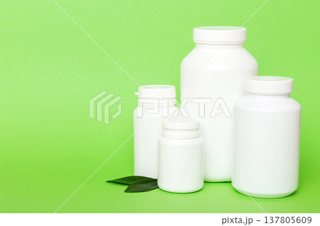 supplement pills with medicine bottle health care and medical top view. Vitamin tablets. Top view mockup bottle for pills and vitamins with green leaves, natural organic bio supplement, copy space supplement pills with medicine bottle health care and medical top view. Vitamin tablets. Top view mockup bottle for pills and vitamins with green leaves, natural organic bio supplement, copy space 137805609