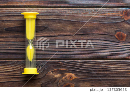 hourglass on the table, sand clock as time passing concept for business deadline, copy space hourglass on the table, sand clock as time passing concept for business deadline, copy space 137805638