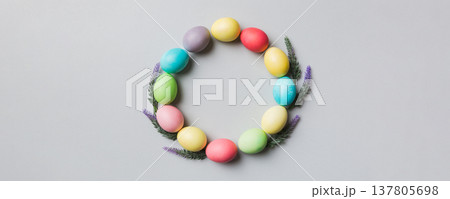 round frame Multi colors Easter eggs on colored background . Pastel color Easter eggs holiday concept with empty space for you design 137805698
