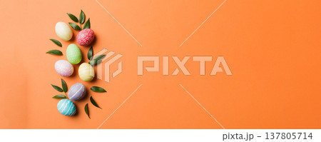 Colorful Easter eggs with spring flower leaf isolated over white background. Colored Egg Holiday border Colorful Easter eggs with spring flower leaf isolated over white background. Colored Egg Holiday border 137805714