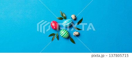 Colorful Easter eggs with spring flower leaf isolated over white background. Colored Egg Holiday border Colorful Easter eggs with spring flower leaf isolated over white background. Colored Egg Holiday border 137805715