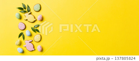 Happy Easter concept. Preparation for holiday. Easter eggs on colored background. flat lay top view copy space banner Happy Easter concept. Preparation for holiday. Easter eggs on colored background. flat lay top view copy space banner 137805824