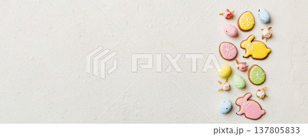 Happy Easter concept. Preparation for holiday. Easter eggs on colored background. flat lay top view copy space banner Happy Easter concept. Preparation for holiday. Easter eggs on colored background. flat lay top view copy space banner 137805833