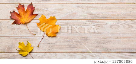 Autumn composition. Pattern made of dried leaves and other design accessories on table. Flat lay, top view Autumn composition. Pattern made of dried leaves and other design accessories on table. Flat lay, top view 137805886