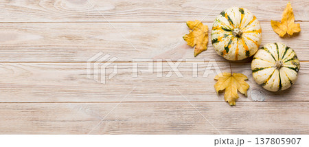 Autumn composition. Pattern made of dried leaves and other design accessories on table. Flat lay, top view Autumn composition. Pattern made of dried leaves and other design accessories on table. Flat lay, top view 137805907