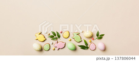holiday preparation Multi colors Easter eggs with cookies on colored background . Pastel color Easter eggs. holiday concept with copy space holiday preparation Multi colors Easter eggs with cookies on colored background . Pastel color Easter eggs. holiday concept with copy space 137806044