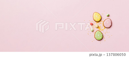 holiday preparation Multi colors Easter eggs with cookies on colored background . Pastel color Easter eggs. holiday concept with copy space holiday preparation Multi colors Easter eggs with cookies on colored background . Pastel color Easter eggs. holiday concept with copy space 137806050