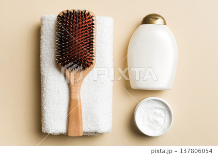 cosmetic for hair care, cream and towel on a colored background top view. flat lay cosmetic for hair care, cream and towel on a colored background top view. flat lay 137806054
