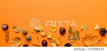 Autumn composition. Pattern made of dried leaves and other design accessories on table. Flat lay, top view 137806137