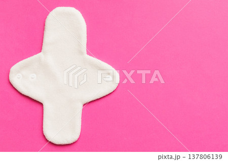 Eco-friendly reusable fabric women's pads. set of colorful bright reusable menstrual pads. zero waste woman periods concept top view with copy space Eco-friendly reusable fabric women's pads. set of colorful bright reusable menstrual pads. zero waste woman periods concept top view with copy space 137806139