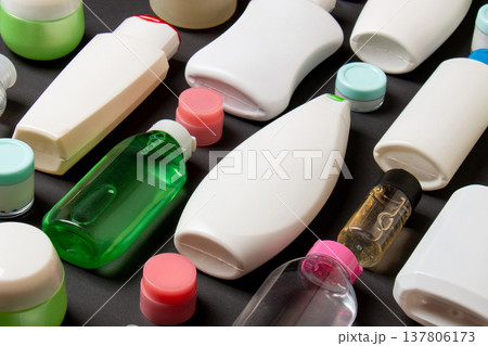 Group of plastic bodycare bottle Flat lay composition with cosmetic products on colored background empty space for you design. Set of White Cosmetic containers, top view with copy space Group of plastic bodycare bottle Flat lay composition with cosmetic products on colored background empty space for you design. Set of White Cosmetic containers, top view with copy space 137806173