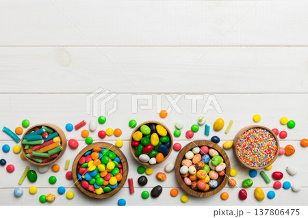 different colored round candy in bowl and jars. Top view of large variety sweets and candies with copy space 137806475