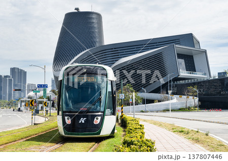 The circular light rail train drives past the Kaohsiung Port Cruise Terminal station in Taiwan. The circular light rail train drives past the Kaohsiung Port Cruise Terminal station in Taiwan. 137807446