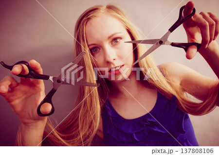 Girl with scissors for haircutting 137808106