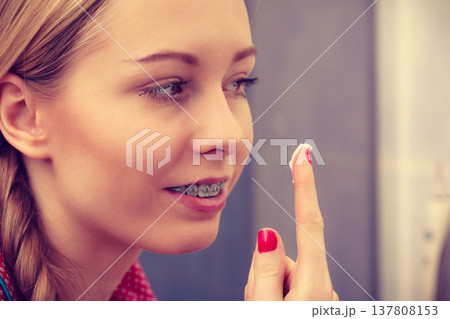 Woman applying moisturizing skin cream. Skincare. Woman applying moisturizing skin cream. Skincare. 137808153