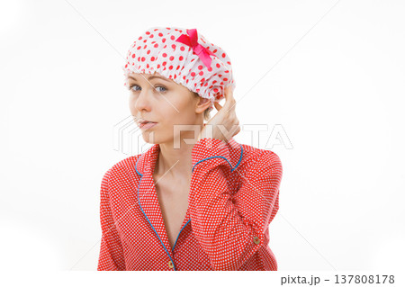 Funny woman wearing pajamas and bathing cap Funny woman wearing pajamas and bathing cap 137808178