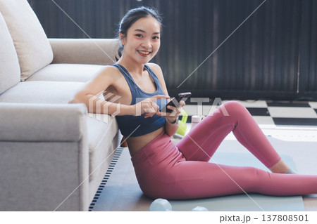 Young Asian sporty attractive people practicing yoga lesson with instructor. Asia group of women exercising healthy lifestyle in fitness studio. Sport activity, gymnastics or ballet dancing class. Young Asian sporty attractive people practicing yoga lesson with instructor. Asia group of women exercising healthy lifestyle in fitness studio. Sport activity, gymnastics or ballet dancing class. 137808501