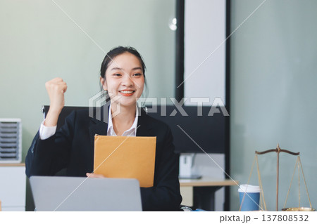 Lawyer explained to the client about the law that must be brought against the court case. Lawyer explained to the client about the law that must be brought against the court case. 137808532