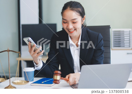 Lawyer explained to the client about the law that must be brought against the court case. Lawyer explained to the client about the law that must be brought against the court case. 137808538