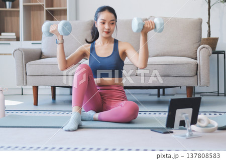 Young Asian sporty attractive people practicing yoga lesson with instructor. Asia group of women exercising healthy lifestyle in fitness studio. Sport activity, gymnastics or ballet dancing class. 137808583