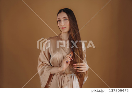 Young woman is against background Young woman is against background 137809473