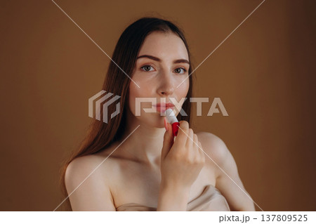 Young woman is against background Young woman is against background 137809525