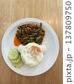 Spicy pork stir fry fried egg white rice cucumber slice thai food asian cuisine street food lunch dinner comfort food homemade savory chili sauce green bean cooked meat protein side dish vegetable 137809750