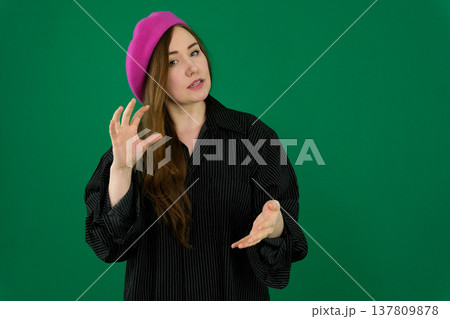 Different emotions of a woman's pose in black on a green background 137809878