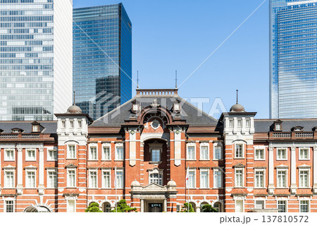 Building view of the Tokyo Station. It's a major inter-city rail terminal in Chiyoda, Tokyo, Japan. located in the Marunouchi business district.  137810572