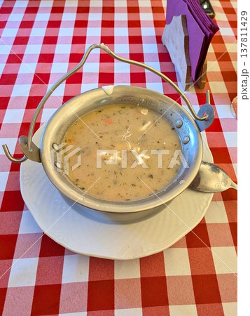 Creamy vegetable soup in metal bowl with handle Creamy vegetable soup in metal bowl with handle 137811429