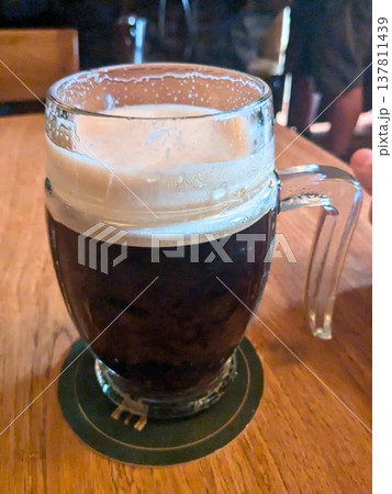 Traditional Dark Beer in Glass Mug 137811439