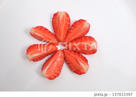 Strawberries decorated with green leaves isolated on white background. Top view. Flat Strawberries decorated with green leaves isolated on white background. Top view. Flat 137813397